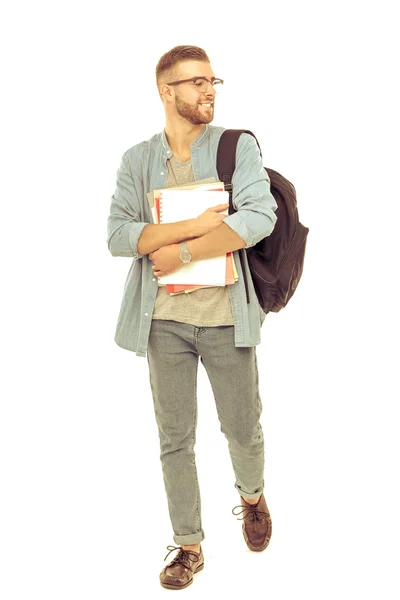 A male student with a school bag holding books isolated on white background — Stock Photo, Image