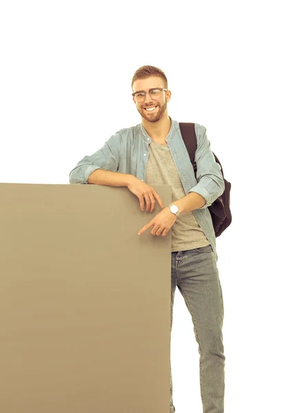 Gambar seorang siswa laki-laki tersenyum memegang papan kosong — Stok Foto