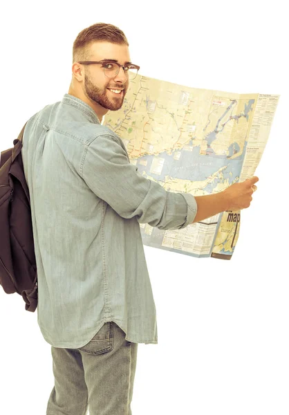 Young man holding map on white background — Stock Photo, Image