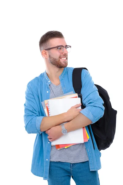 Um estudante do sexo masculino com um saco escolar segurando livros isolados em fundo branco — Fotografia de Stock