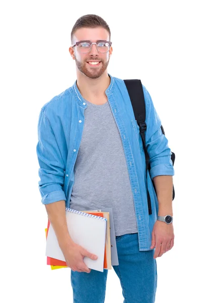 Um estudante do sexo masculino com um saco escolar segurando livros isolados em fundo branco — Fotografia de Stock