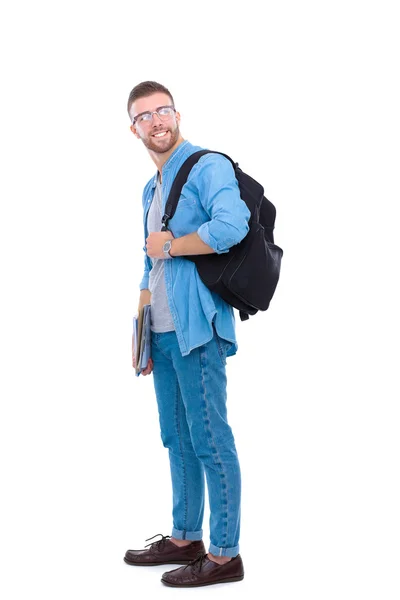 Um estudante do sexo masculino com um saco escolar segurando livros isolados em fundo branco — Fotografia de Stock