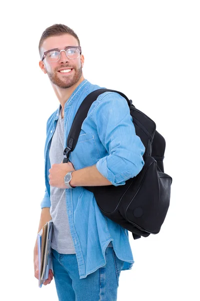 Un estudiante masculino con una bolsa de la escuela sosteniendo libros aislados sobre fondo blanco — Foto de Stock