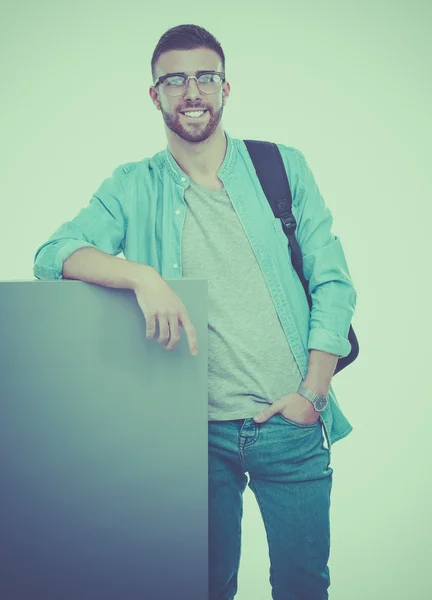 Retrato de un estudiante sonriente sosteniendo tablero en blanco — Foto de Stock