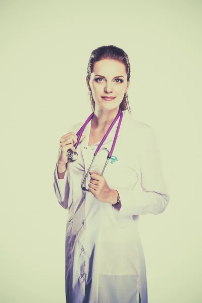 Portrait of young woman doctor with white coat standing in hospital — Stock Photo, Image