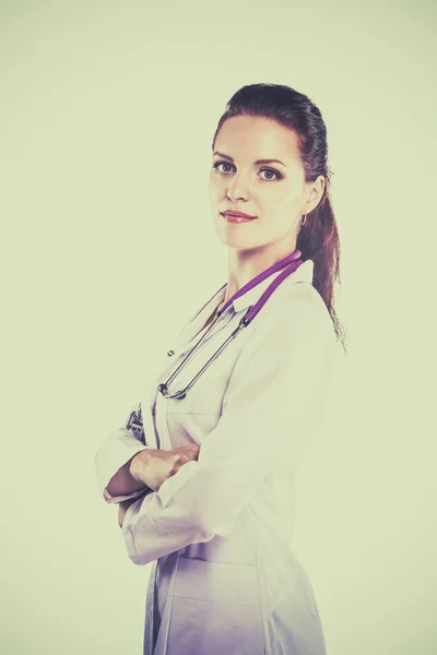 Portrait of young woman doctor with white coat standing in hospital — Stock Photo, Image