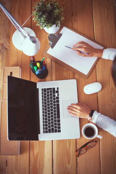 Young female working sitting at a desk