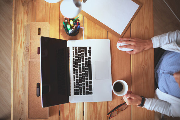Young female working sitting at a desk