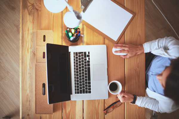 Young female working sitting at a desk