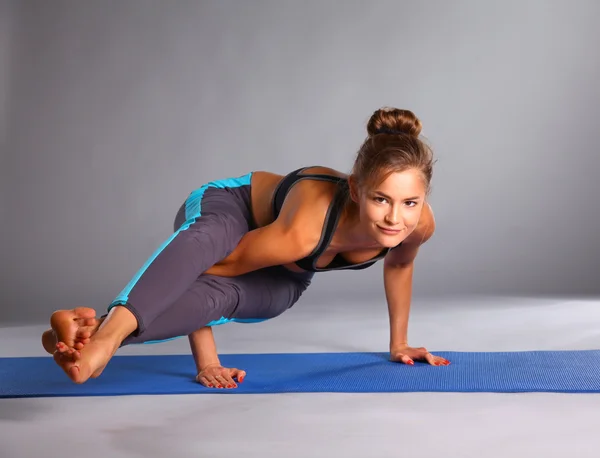 Portrait of sport girl doing yoga stretching exercise — Stock Photo, Image