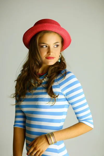 Portrait of young beautiful brunette woman in hat — Stock Photo, Image