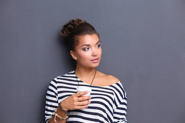 Portrait of young woman with cup tea or coffee — Stock Photo, Image