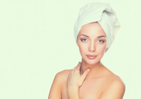 Portrait of beautiful girl touching her face with a towel on head — Stock Photo, Image