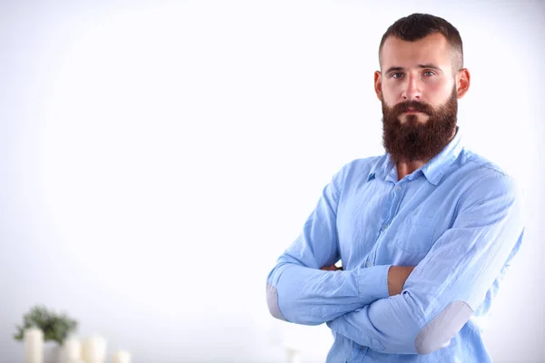 Successful young business man standing in office — Stock Photo, Image