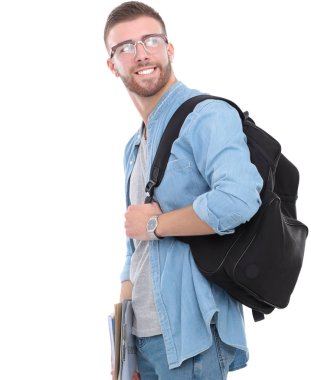 Okul çantası beyaz arka plan üzerinde izole kitap holding ile genç erkek öğrenci