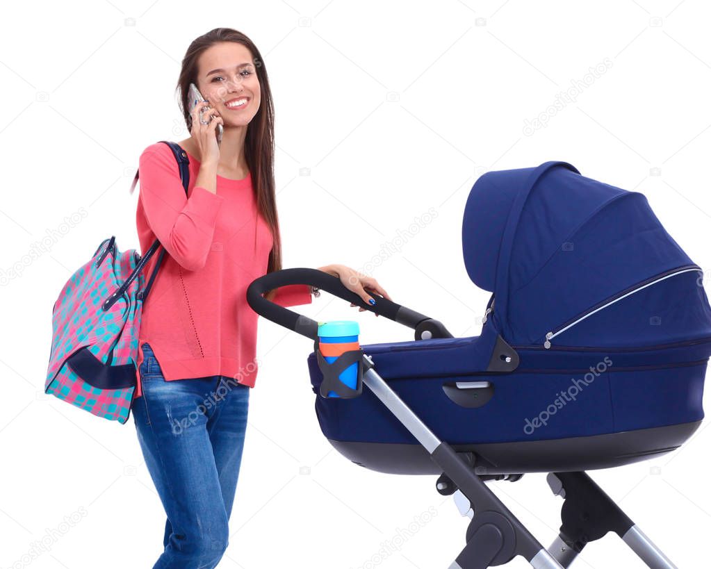 Full length portrait of a mother with a stroller, isolated on white background