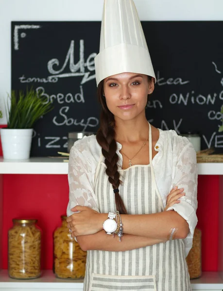 Chef woman portrait with uniform in the kitchen