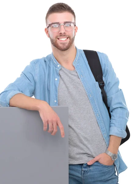 Joven estudiante masculino con bolso escolar sosteniendo libros aislados sobre fondo blanco — Foto de Stock