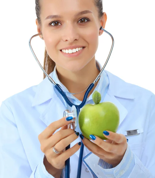 医生用听诊器检查苹果的女人 — 图库照片