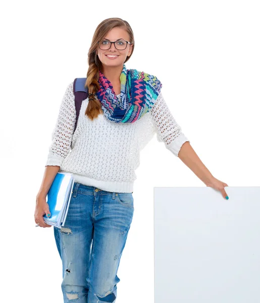 Hermosa estudiante apuntando en el tablero en blanco —  Fotos de Stock