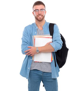 Okul çantası beyaz arka plan üzerinde izole kitap holding ile genç erkek öğrenci