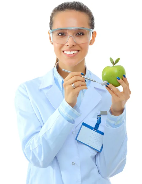 Dentist medical doctor woman hold green fresh apple in hand and mirror — Stock Photo, Image