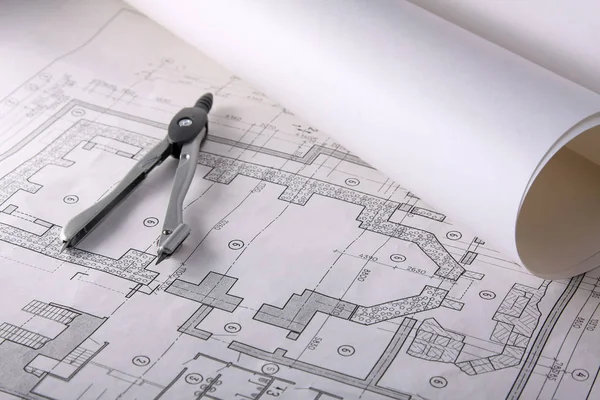 Plany architektoniczne, kompas i linijka na biurku — Zdjęcie stockowe