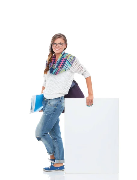 Beautiful student woman pointing on blank board — Stock Photo, Image