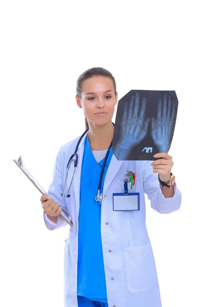 Young female doctor looking at the x-ray picture isolated on white background — Stock Photo, Image