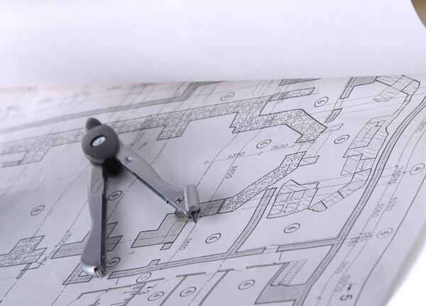 Architectural plans, compass and ruler on the desk