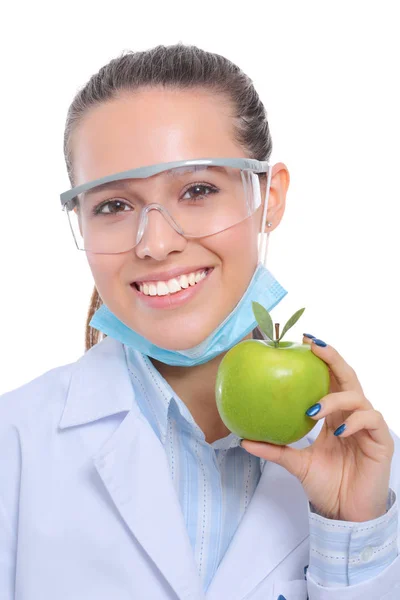 Mulher sorridente médico com uma maçã verde — Fotografia de Stock