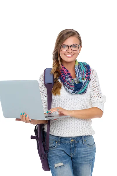 Smiling teenager with laptop on white background — Stock Photo, Image