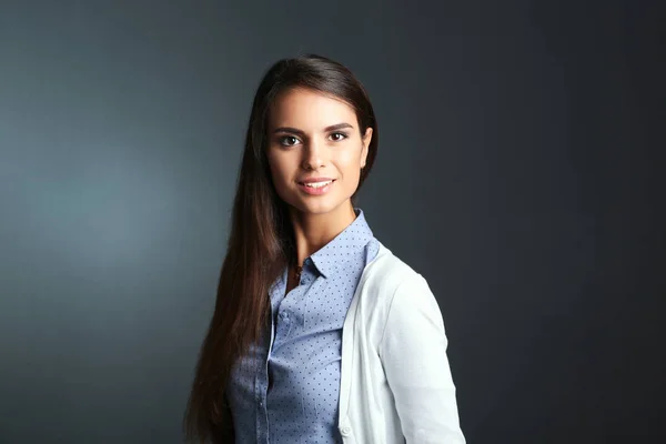 Portrait of a businesswoman , against dark background — Stock Photo, Image