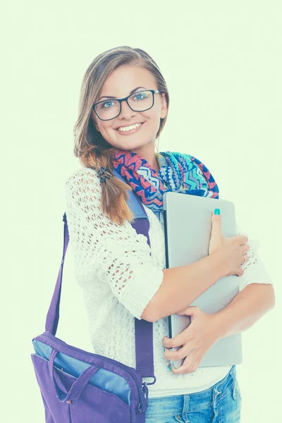 Adolescente sonriente con portátil sobre fondo blanco — Foto de Stock