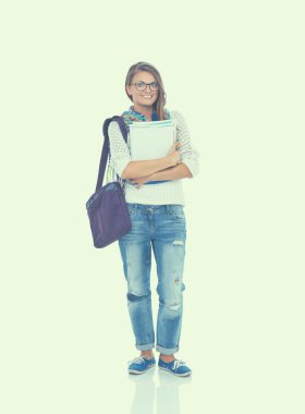 Egzersiz kitap tutan bir genç öğrenci kadın portresi.