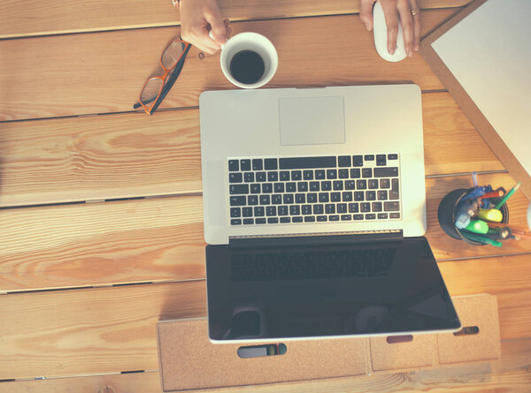 Young female working sitting at a desk