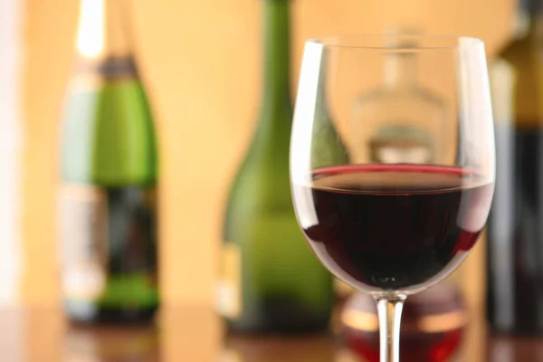 Glass of red wine and the bottle — Stock Photo, Image