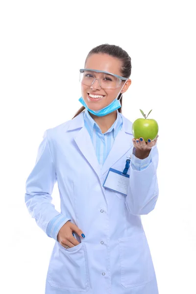 Sorridente medico donna con una mela verde — Foto Stock