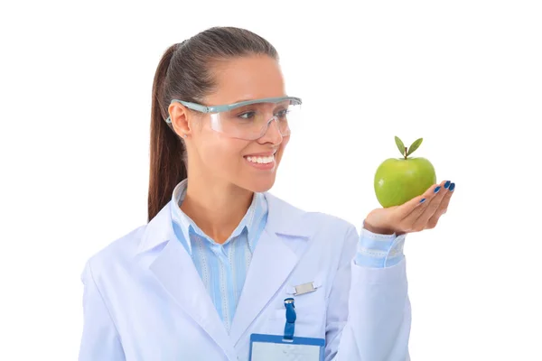 Mulher sorridente médico com uma maçã verde — Fotografia de Stock