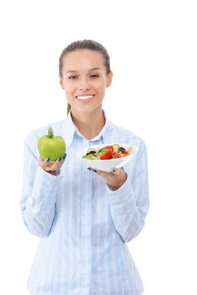 Ritratto di una bella donna medico in possesso di piatto con verdure fresche e mela verde — Foto Stock