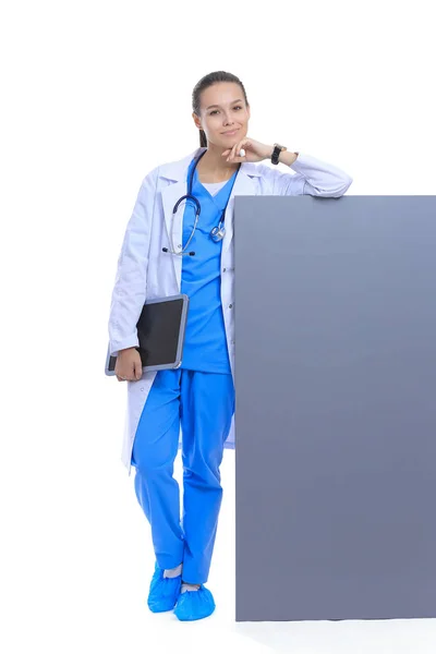 Female doctor with a blank billboard. — Stock Photo, Image