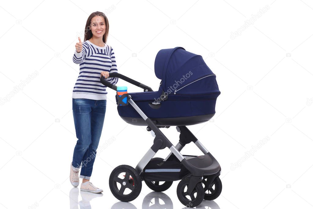 Full length portrait of mother with a stroller showing ok, isolated on white background