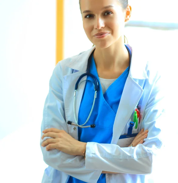 Woman doctor standing at hospital near window — Stock Photo, Image