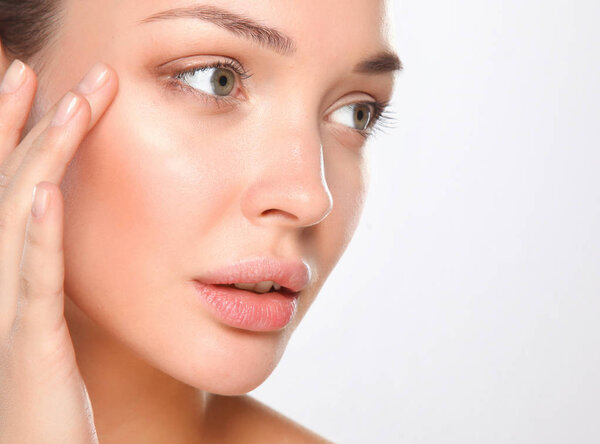 Close up portrait of beautiful young woman face. Isolated on white background.