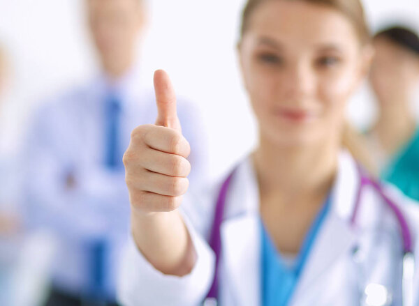 Woman doctor standing with stethoscope at hospital