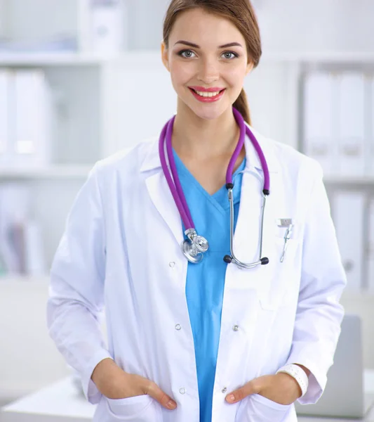 Medical team sitting at the table in modern hospital Stock Photo