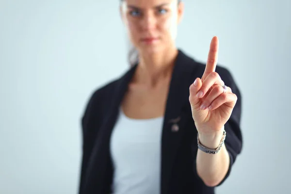 Mulher tocando uma tela imaginária com o dedo — Fotografia de Stock