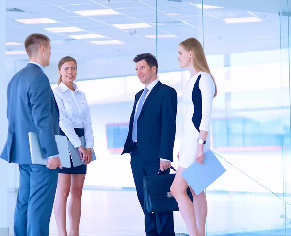 Smiling successful business team standing in office — Stock Photo, Image