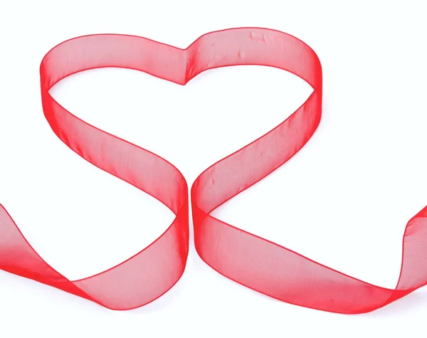 A red ribbon shaping heart , isolated on white background — Stock Photo, Image