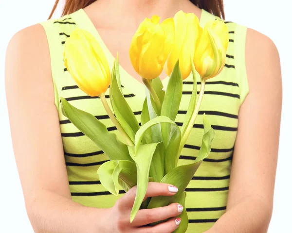 happy woman with yellow tulips over white background